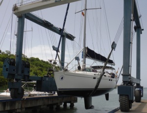 The keel on a sailing boat as it is lifted out of the water.